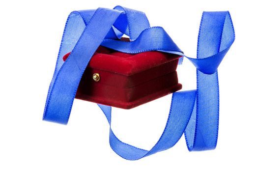 Red velvet gift box and blue ribbon on a white background