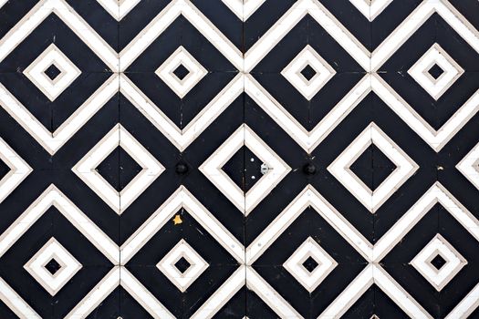 Striped black and white wooden door