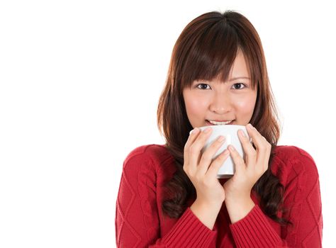 Beautiful mixed Asian woman drinking coffee or tea, isolated on white background