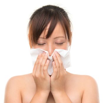 Young Asian woman using a facial tissue, isolated on white