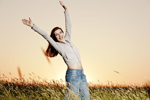 Outdoor portrait of a woman on a meadow releaxing