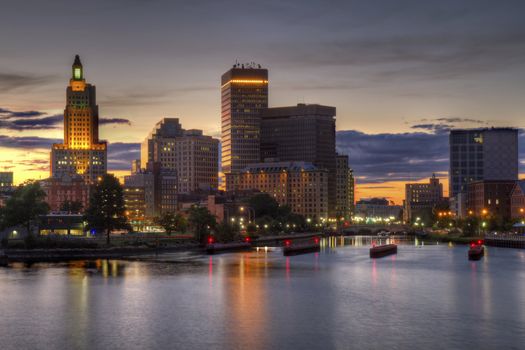 HDR image of the skyline of Providence, Rhode Island from the far side of the Providence River viewed just as the sun is setting at dusk