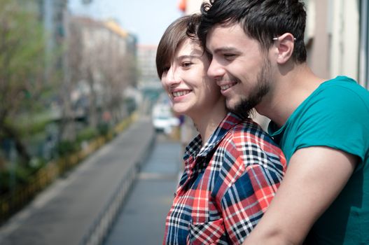 couple embracing on balcony