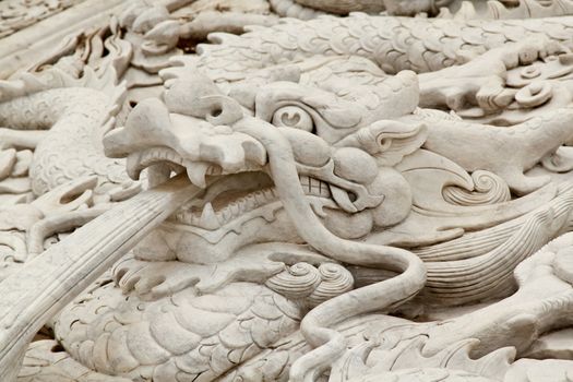 Closeup with dragon statue in chinese temple