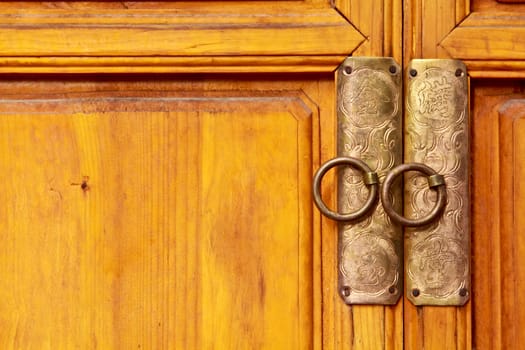 Traditional chinese old knocker on wood door