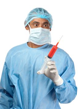A surgeon concentrates sharply on the the contents of an injection syringe in his hand.