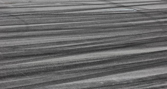 Background with tire marks on road track