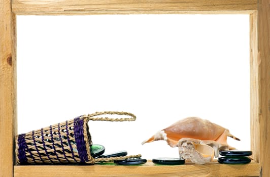 Wicker, green pieces of glass and sea shells inside rough wooden frame on white background