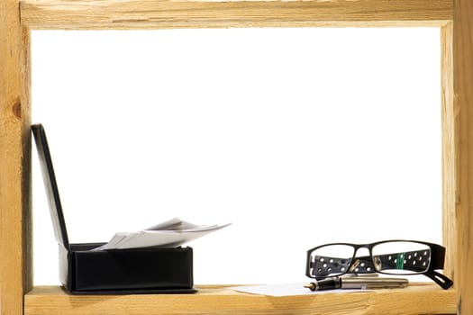 A sheet of white paper and fountain pen with gold nib  inside rough wooden frame on white background