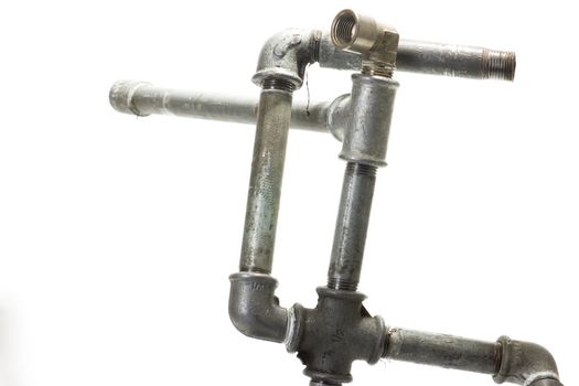 The construction of metal connectors and water pipes on a white background