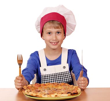 happy boy chef eat pizza