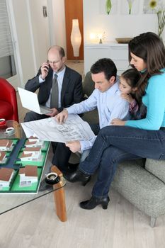 Architect sat with young family