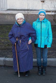 Grandmother and granddaughter for a walk.