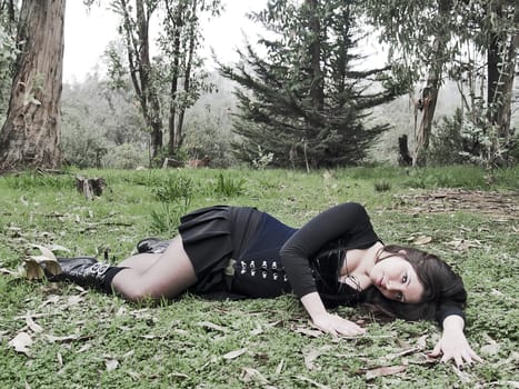 Young woman laying at the forest