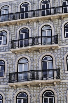 Traditional portuguese glazed tile facade with balconiesin Lisbon, at Bairro Alto district