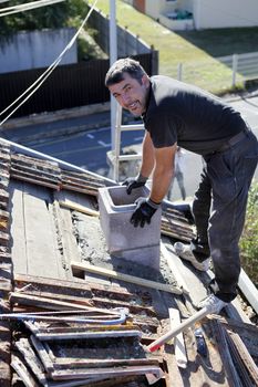 Roofer replacing shingles