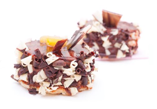 Closeup of Mini Desserts With Chocolate Shavings on White Background