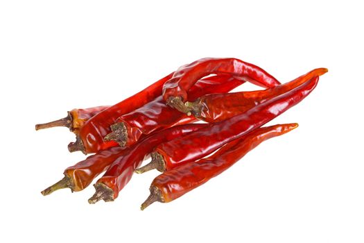 Nine dried red hot chili peppers isolated against a white background