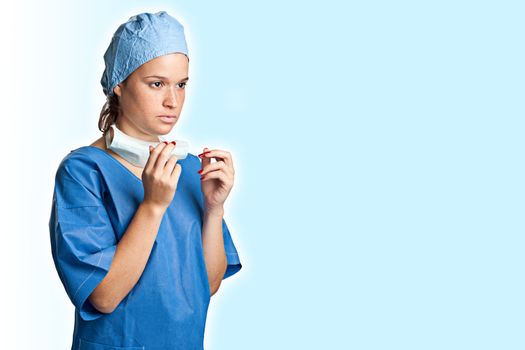 Young female surgeon getting ready for a surgery