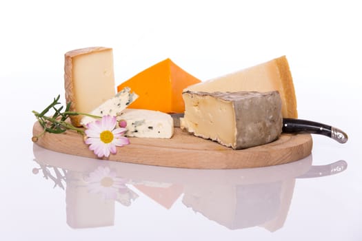 Composition of French cheese on wooden board