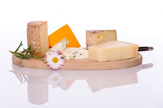 Composition of French cheese on wooden board