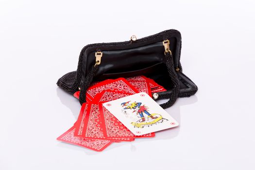 Small black lady handbag and red play cards