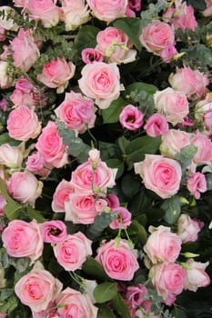 Lisianthus and roses in a pink wedding centerpiece