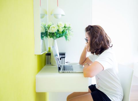 college student and laptop study at home