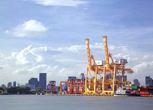 Container stacks and crane bridge in shipyard for cargo and Logistic background