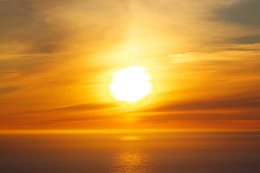 Bright midnight sun over the ocean on Lofoten islands in Norway