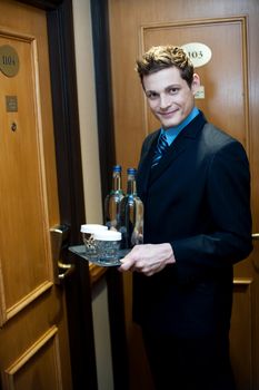 Beverages are ready to be delivered by a well dressed male executive