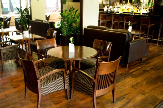 Row of tables neatly arranged in a restaurant. Experience fine dining