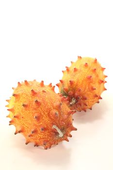 two fresh horned melon on a light background