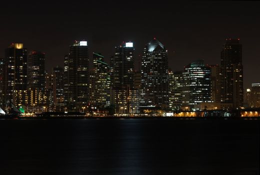 View of a partial skyline of San Diego, California from the water at night