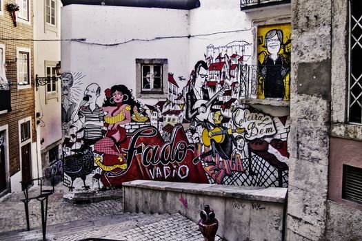 Graffiti symbolizing Lisbon and her traditional music called fado, on a wall on Lisbon downtown
