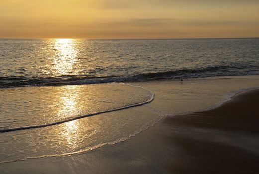 Early-morning sunlight reflected off the Atlantic ocean at a beach in Nags Head on the Outer Banks of North Carolina