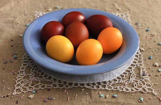 Easter eggs on a blue plate