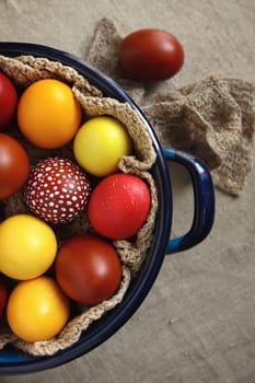 Multi-colored Easter eggs in a pot