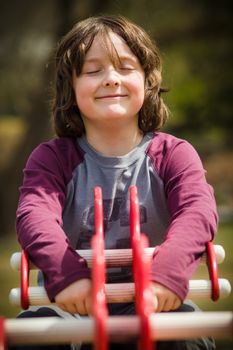 Young boy on a teeterboard