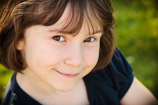 Girl smiling outside on a sunny day