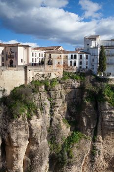 View of buildings in new town from other side of the 18th century bridge over the 300 ft Tajo Gorge in Ronda Spain
