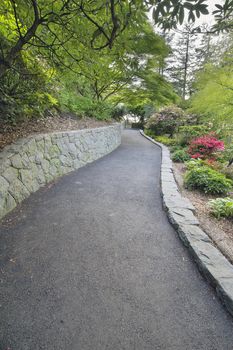 Walking Asphalt Path with Stone Retaining Wall at Crystal Springs Rhododendron Garden