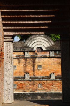 Brick wall with relief decoration and style of ancient Javanese kingdom building