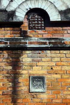 Brick wall with relief decoration and style of ancient Javanese kingdom building