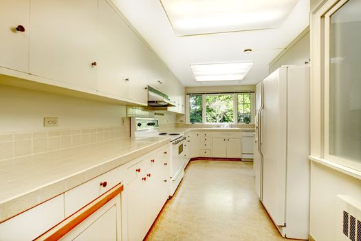 White empty simple old kitchen interior in American historical house.