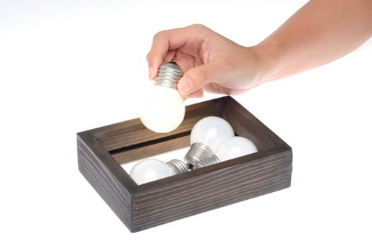 think outside the box concept,light bulb is brightly after is picked out of the frame