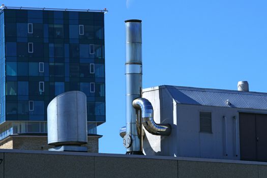 Vents of ventilation are located on a roof of a  building