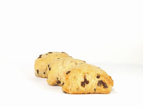 three spongy chocolate chip scones on white background