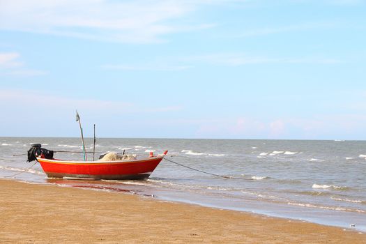 Fishing boat on the beach in front of the Pranburi sea 