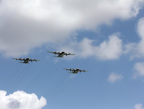 Three Israeli Air Force four-engine turboprop powered airplanes at parade in honor of Independence Day